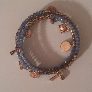 Blue bracelet with gold charms